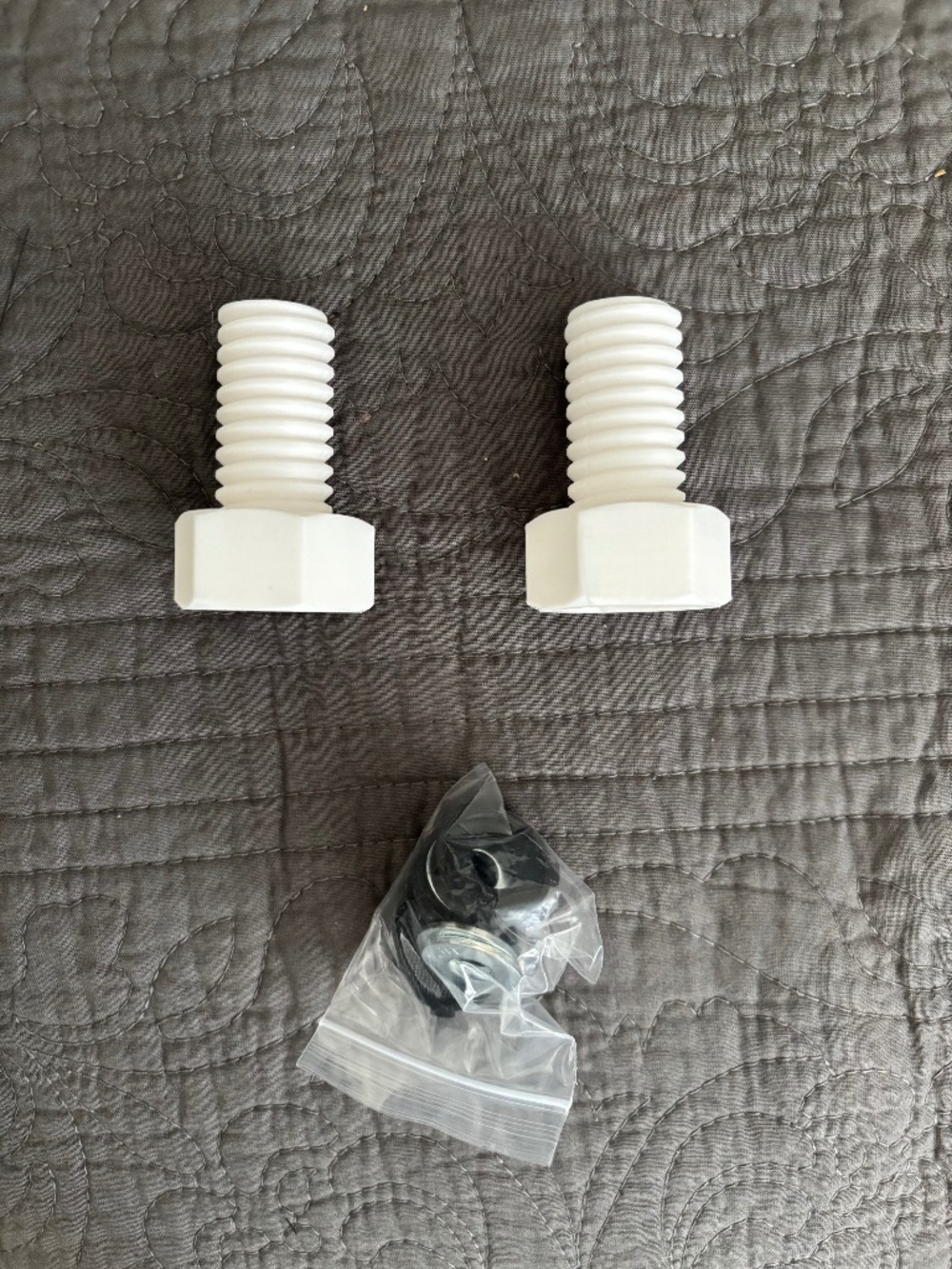 Adorable white 3-D printed “BOLT” Toilet Bowl Bolt Covers.